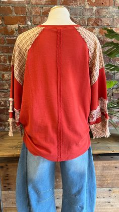 Get ready for Fall in our red peace and love top! Adorable mixed fabric heart shaped peace sign is perfect for our boho ladies. Would be perfect for a a fun game day look whn you want something a little more unique. Pairs great with our barrel jeans or our embroidered yoga flares! Looks cute with a front tuck, a side knit, or loose and flowy. Oversized fit - read measurements before buying. Fabric 100% Cotton Measurements taken flat S- Bust 24" Length 27" M- Bust 25" Length 27.5" L- Bust 26" Length 28" Bohemian Crew Neck Top For Layering, Hippie Patchwork Tops For Festival, Red Cotton Tops For Layering, Casual Festival Tops For Fall, Casual Tops For Fall Festival, Casual Fall Festival Tops, V-neck Festival Tops For Fall, Hippie Patchwork Tops For Fall, Hippie Crew Neck Top For Fall