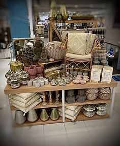 the shelves are filled with many different types of furniture and home decor items for sale