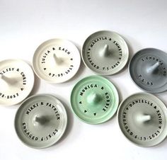 six porcelain plates with words and numbers on them