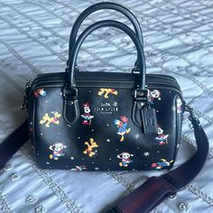 New Without Tags, Disney Characters Holiday Print, Excellent Condition Black Disney Bags With Character Print, Black Mickey Mouse Bag For Disney Fan Events, Paw Wallpaper, Coach Rogue, Coach Disney, Coral Accents, Brown Leather Satchel, Coach Satchel, Coach 1941