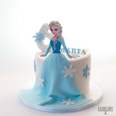 a frozen princess cake with snowflakes on it