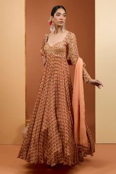 Peach flared anarkali with almond digital print and mirror, sequins, thread tassels embroidery. Paired with coordinating printed dupatta. - Aza Fashions Fitted Georgette Anarkali Set For Reception, Fitted Anarkali Sharara With Embroidery, Fitted Art Silk Salwar Kameez Chandbali, Fitted Embroidered Anarkali Set For Eid, Traditional Fitted Anarkali Set With Dupatta, Embroidered Fitted Anarkali Set For Eid, Fitted Maxi Length Choli With Resham Embroidery, Eid Anarkali Set With Zari Work, Fitted, Fitted Anarkali Embroidered Sharara