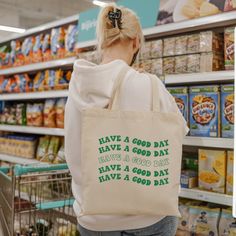 "Say no to plastic with this trendy aesthetic tote bag. Designed to make you look cute while helping the earth, this canvas tote bag is perfect for your next trip to the grocery store, mall, beach, or library.  The details: -100% cotton sheeting -Reinforced handle stitching  -15.75\" H x 15.25\" W -Handle is 21.5\" in length  -       Printed in the USA" Gifts For Teenage Girls, Tote Bag Outfit, Tote Bag Aesthetic, Bag Aesthetic, Sustainable Shopping, Trendy Tote Bags, Trendy Aesthetic, Personalized Tote Bags