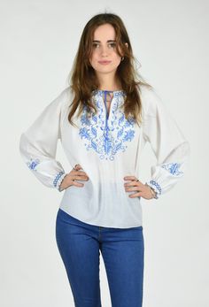 DESCRIPTION The 'Pamela' Very Pretty Vintage 80's Embroidered Blue Floral Long Sleeve Peasant Blouse Made from a Light Weight White Soft Polyester Fabric. Pretty Cross stitch Floral and Leaf Embroidery in Blue and White On Front and Long Sleeves. Smocked Embroidered Detailing and Blue Blanket Stitch Detail on Neckline and Cuffs. Pull on Style with a Round Neckline with Small Centre Front Opening and a Blue Tie. Straight Hemline with Blue Blanket Stitch and Below Waist Length. DETAILS: Fabric : P Folk Style Blouse With Tonal Embroidery For Spring, Traditional Tonal Embroidered Top For Spring, Spring Folk Peasant Top With Embroidered Border, Spring Peasant Top With Embroidered Border, Spring Embroidered Peasant Top, Spring Embroidered Border Peasant Top, Embroidered Border Blouse For Spring, Traditional Spring Peasant Top With Embroidered Border, Peasant Spring Tops With Embroidered Border