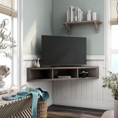 Get the most effective use out of your wall space with this corner floating TV console, made from solid wood in a handsome walnut oak finish. Fitting efficiently into a tight corner, this wall-mounted unit can accommodate up to a 46 in. flat screen TV. Three open cubbies add bonus storage and display space. Furniture of America Emmeline Modern/Contemporary Walnut Oak Corner Tv Stand Integrated Tv Mount (Accommodates TVs up to 50-in) in Brown | IDI-182359 Mounted Corner Tv, Corner Unit Tv Stand, Oak Corner Tv Stand, Corner Tv Console, Coin Tv, Floating Tv Console, Wall Mounted Media Console, Modern Media Console, Floating Tv