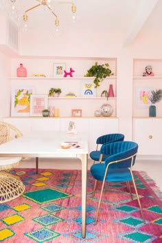 a living room filled with furniture and colorful rugs on top of a carpeted floor