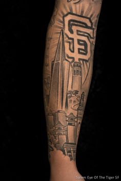 a man's arm with tattoos on it and the word san francisco written in black ink