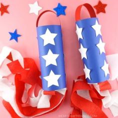 two red, white and blue firecrackers are on a pink background with stars