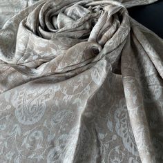 Exquisite merino wool shawl in soft,  beige shades, decorated with an eternal pattern of paisley, which adorns the entire space of this accessory. Made of high quality merino wool, this shawl combines the highest quality with a delicate, delicate weave that provides unprecedented warmth and comfort. If you dress for a special occasion or add a little luxury to your everyday clothes, this shawl will be the embodiment of cozy sophistication. Plunge into elegance and experience the unrivalled charm Shawls Design, Bohemian Pashmina Scarf For Weddings, Bohemian Pashmina Scarves For Wedding, Bohemian Pashmina Wedding Scarf, Cream Pashmina Scarves For Wedding, Formal Elegant Pashmina Shawl, Cream Pashmina Dupatta For Wedding, Wedding Pashmina Silk Shawl, Elegant Cream Silk Shawl Scarf