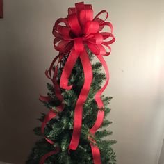 a christmas tree with a red bow on it