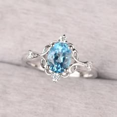 ◆ The ring is handcrafted from sterling silver and decorated with a dazzling 8*6 mm Swiss blue topaz and CZs. It is suitable for engagement/anniversary/daily occasion. ◆ Production Description: Main stone Type: Swiss Blue Topaz Main Stone Shape: Oval Cut Main Stone Size: 8*6 mm(1.47ct) Side stone: CZ Metal: 925 Sterling silver - Other options available in the drop down menu ◆ Customization: √Free for Add Engraving √Other Metal Type Available √Other Gemstones & Shapes Available √Personalization R Silver Rings With Blue Stones, Blue Topaz Wedding Ring Set, Silver And Blue Ring, Engagement Rings Silver Sapphire, Light Blue Wedding Rings, Silver Ring With Blue Stone, Silver And Blue Rings, Blue Engagement Ring Silver, Engagement Rings Topaz