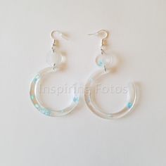 This pair of resin open hoop earrings is part of the Touch of Jewelry collection. These clear resin earrings are 3 1/2 inch drop open hoops with blue sequin flakes. Perfect gift for friends or family members for any occasion. Nutcrackers Display, Open Hoop Earrings, Gilbert Az, Hoops Earrings, Holiday Paper, Resin Earrings, Clear Resin, Jewelry Earrings Hoops, Tea Light Holder