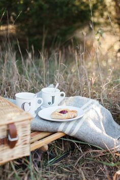 a picnic in the woods with food and coffee