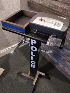 a police sign sitting on top of a wooden table