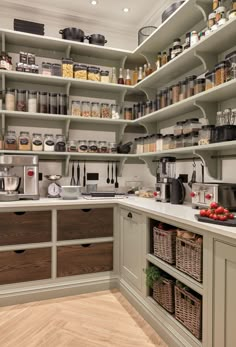 a kitchen with lots of shelves filled with food