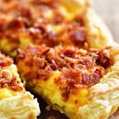 a bacon and cheese quiche on a cutting board