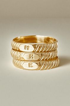 A stack of three personalized Initial Signet Rings, each engraved with the letters M, R, and E, featuring a textured, braided design in 14k gold filled. Rings With Initials, Creative Background, Gold Signet Ring, Everyday Rings, Gold Band, Signet Ring, Stacking Rings, Custom Rings, Gold Bands