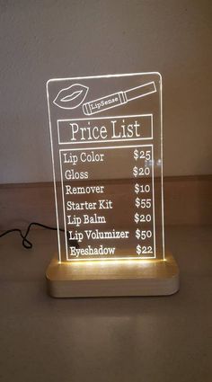 a lighted price list on a table with a light in the shape of a phone