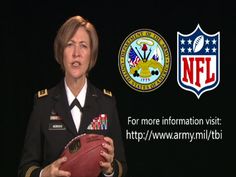 a woman in uniform holding a football and an nfl logo on the wall behind her