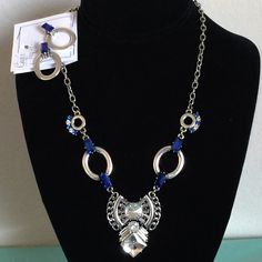 This New Women's Fashion Silver Necklace And Earring Set Is 18" Along With A 2" Drop And Claw Closure. The Necklace Contains Fashion Blue And Clear Crystals. The Earrings Are Fashion Silver With Blue And Clear Crystals. This Set Is Sold By A Vendor Called Howard's Sold By Gigi's Tre Chic Nickel-free Sapphire Jewelry For Party, Sapphire Nickel-free Jewelry For Party, Sapphire Metal Jewelry For Party, Sapphire Party Jewelry, Blue Metal Jewelry Sets, Blue Sterling Silver Costume Jewelry, Blue Costume Jewelry In Sterling Silver, Nickel Free Blue Jewelry Sets, Blue Metal Jewelry Sets As A Gift