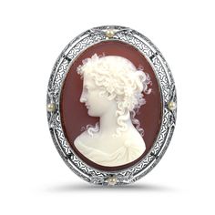 The 14K yellow and white gold Victorian cameo brooch is an elegant and timeless piece. It features a beautifully carved red agate cameo portrait, measuring 36x28mm, which is securely bezel set in a milgrained mounting. The intricate milgrained open-worked filigree frame adds to its antique charm and sophistication. Enhancing its beauty, the brooch is adorned with four 2.3mm seed pearls positioned at the north, south, east, and west points, adding a touch of classic elegance. Measuring 45x36mm, t Carved Oval Brooches For Formal Wear, Carved Oval Brooch For Formal Wear, Carved Oval Brooch For Formal Occasions, White Oval Cameo Brooches, White Cameo Brooches For Formal Occasion, White Cameo Brooch For Formal Occasions, Heirloom Cameo Brooches For Formal Occasions, Heirloom Style Cameo Brooch For Formal Occasions, Heirloom Cameo Brooch For Formal Occasions