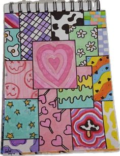 a spiral notebook covered in lots of different colored squares and hearts on the front cover