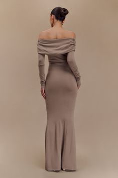 Elegantly draped. Elevate your wardrobe with the GEORGIANA Off Shoulder Knit Midi Dress, featuring a chic Bardot neckline and long sleeves that beautifully frame your shoulders. The bodycon fit and ruched overlay create a flattering silhouette, while the scooped front neckline and centre front shoulder tie add stylish details. Flowing into a fishtail hem shape, this midi-length dress exudes sophistication, making it perfect for any occasion. Pair it with strappy heels for a captivating look. Dramatic Dresses, Bardot Neckline, Knit Midi, Knit Midi Dress, Midi Length Dress, Strappy Heels, Midi Length, Latest Fashion Trends, Latest Fashion