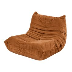 a large brown chair sitting on top of a white floor