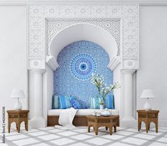 a living room with blue and white tiles on the wall