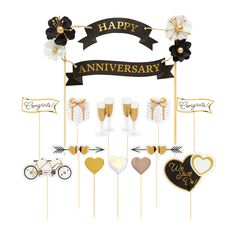 a happy anniversary cake topper with wine glasses and flowers on it, surrounded by other decorations