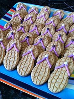 some cookies are decorated with purple icing on them