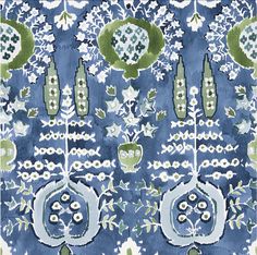 a blue and green pattern with white flowers