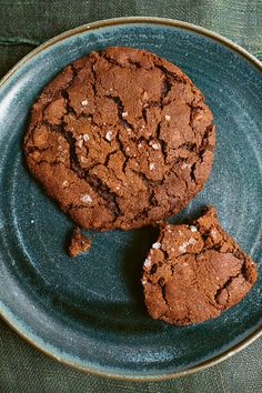 two chocolate cookies on a blue plate