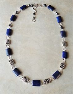 "This necklace combines beautiful blue lapis lazuli natural stone, with sculpted metal castings. Metal is made of pewter and plated in sterling silver. Necklace is finished with a simple lobster claw closure. Necklace measures 18\" in length, with 2 inches extension. This gorgeous necklace is unique, feminine and eye-catching, Perfect for anyone that wants to make a statement or to wear to a special occasion!" Silver Lapis Lazuli Gemstone Beads Necklace, Silver Lapis Lazuli Jewelry With Polished Beads, Silver Beaded Lapis Lazuli Jewelry, Silver Lapis Lazuli Beaded Necklace, Silver Lapis Lazuli Round Bead Jewelry, Lapis Lazuli Gemstone Beads Necklace In Silver, Silver Beaded Necklace With Lapis Lazuli Natural Stones, Silver Beaded Necklaces With Lapis Lazuli Natural Stones, Silver Beaded Necklace With Natural Lapis Lazuli Stones