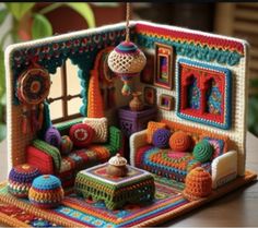 a crocheted doll house with furniture and accessories