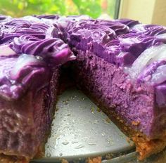 a close up of a cake with purple icing on it's crusts