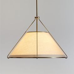 a light hanging from a ceiling fixture with a white fabric covering on the top and bottom