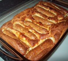 a pan filled with food sitting on top of a stove