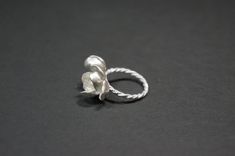 -Product description- Handmade sterling silver (925) jasmine ring. The ring shank is handmade with twisted and beaded wire. The inner surface of the jasmine petal was carefully hand textured to be shimmery. While the outer layer was smooth and shiny, to give a beautiful contrast. A freshwater pearl was then attached to give an elegant touch. Great as a gift for her, or a treat for yourself. The jasmine blossom and bud part are about 25mm in length (1 inch) and 17mm (11/16 inch) in width, weighin Handmade Delicate Silver Flower Ring, Delicate Handmade Silver Flower Ring, Elegant Adjustable Sterling Silver Flower Ring, Handmade Delicate Flower Ring In Sterling Silver, Handmade Elegant Silver Flower Ring, Elegant Handmade Silver Flower Ring, Handmade Sterling Silver Flower Ring For Wedding, Handmade Silver Flower Ring, Elegant Handmade White Gold Flower Ring