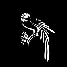 a black and white image of a bird with flowers in its beak on a dark background