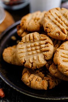 a plate full of peanut butter cookies on a table