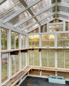 the inside of a building with lots of windows and wood trimmings on it