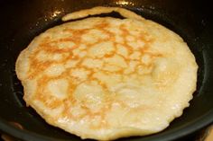 an omelet is cooking in a skillet on the stove top, ready to be cooked