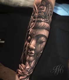 a woman's arm with a buddha tattoo on the left forearm and an intricate head