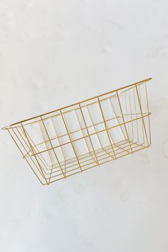 a wire basket hanging from the ceiling