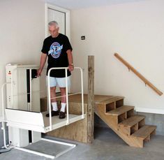 an older man is walking up the stairs in his home with no shoes or socks on