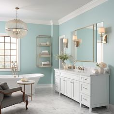 a bathroom with blue walls and white fixtures