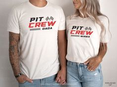 a man and woman standing next to each other wearing matching t - shirts that read pit crew