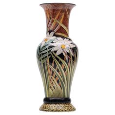 a decorative vase with flowers painted on the front and sides, sitting against a white background