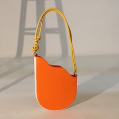 Sunset Duo Bold and Neutral Shoulder Bag Pair - TGC Boutique - Shoulder Bag Modern Orange Everyday Shoulder Bag, Modern Orange Crossbody Shoulder Bag, Modern Orange Shoulder Bag With Adjustable Strap, Modern Orange Everyday Bag, Modern Orange Everyday Bags, Modern Orange Shoulder Bag For Travel, Orange Bucket Bag With Removable Pouch For Shopping, Orange Bucket Bag With Detachable Handle, Orange Handheld Travel Bag